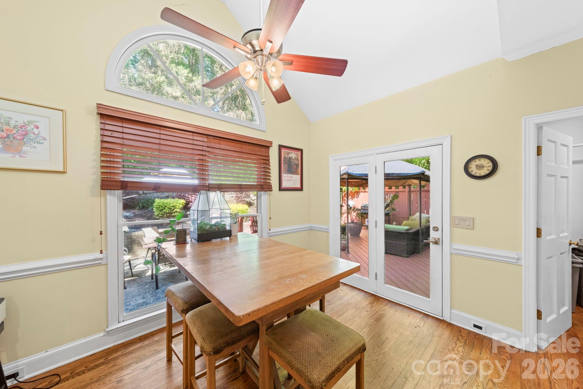1265 Braeburn Road Northwest Concord, NC 28027 - Photo 13 of 48 a view of a dining room with furniture window and wooden floor