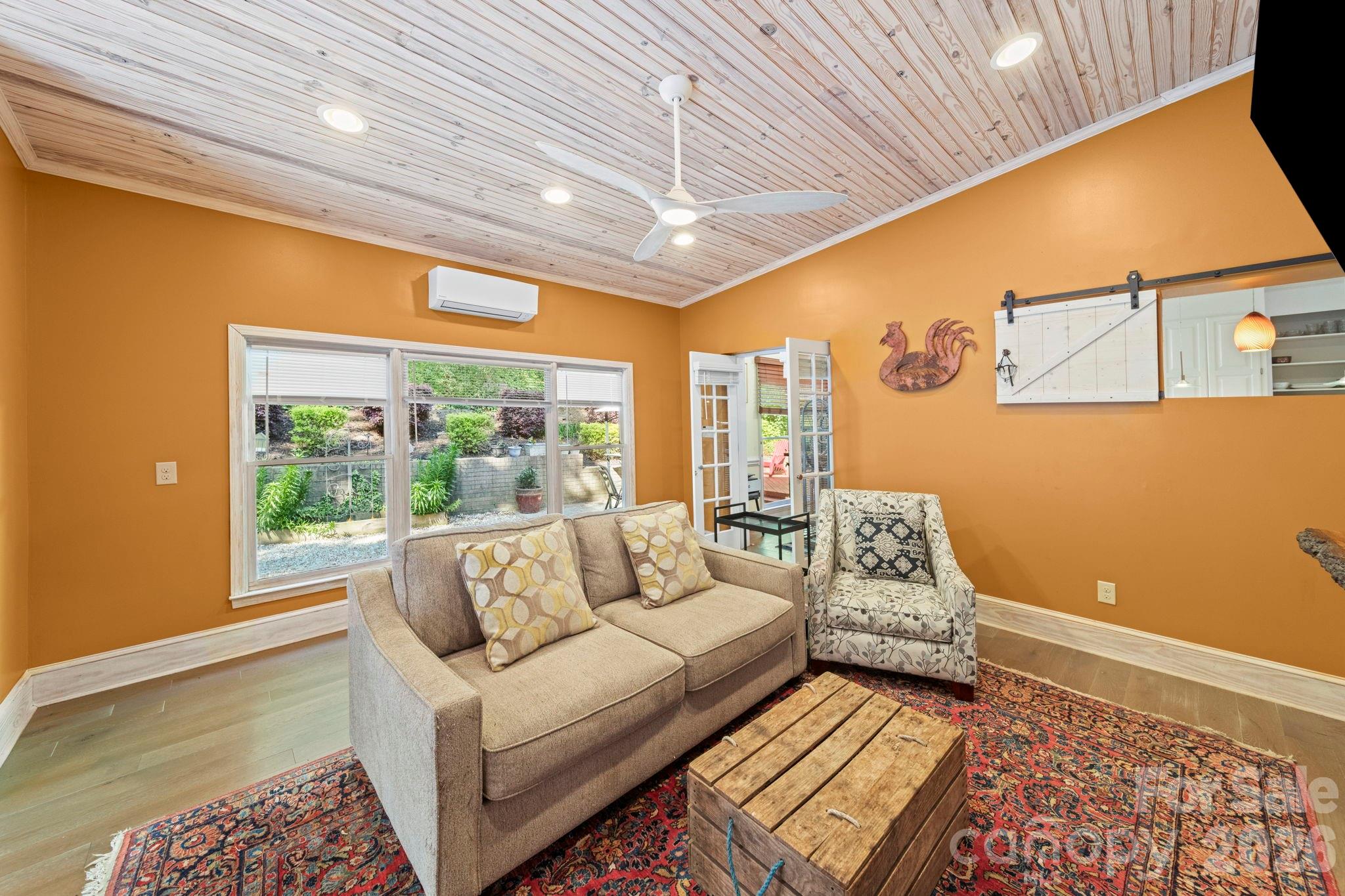 1265 Braeburn Road Northwest Concord, NC 28027 - Photo 20 of 48 a living room with furniture and a large window