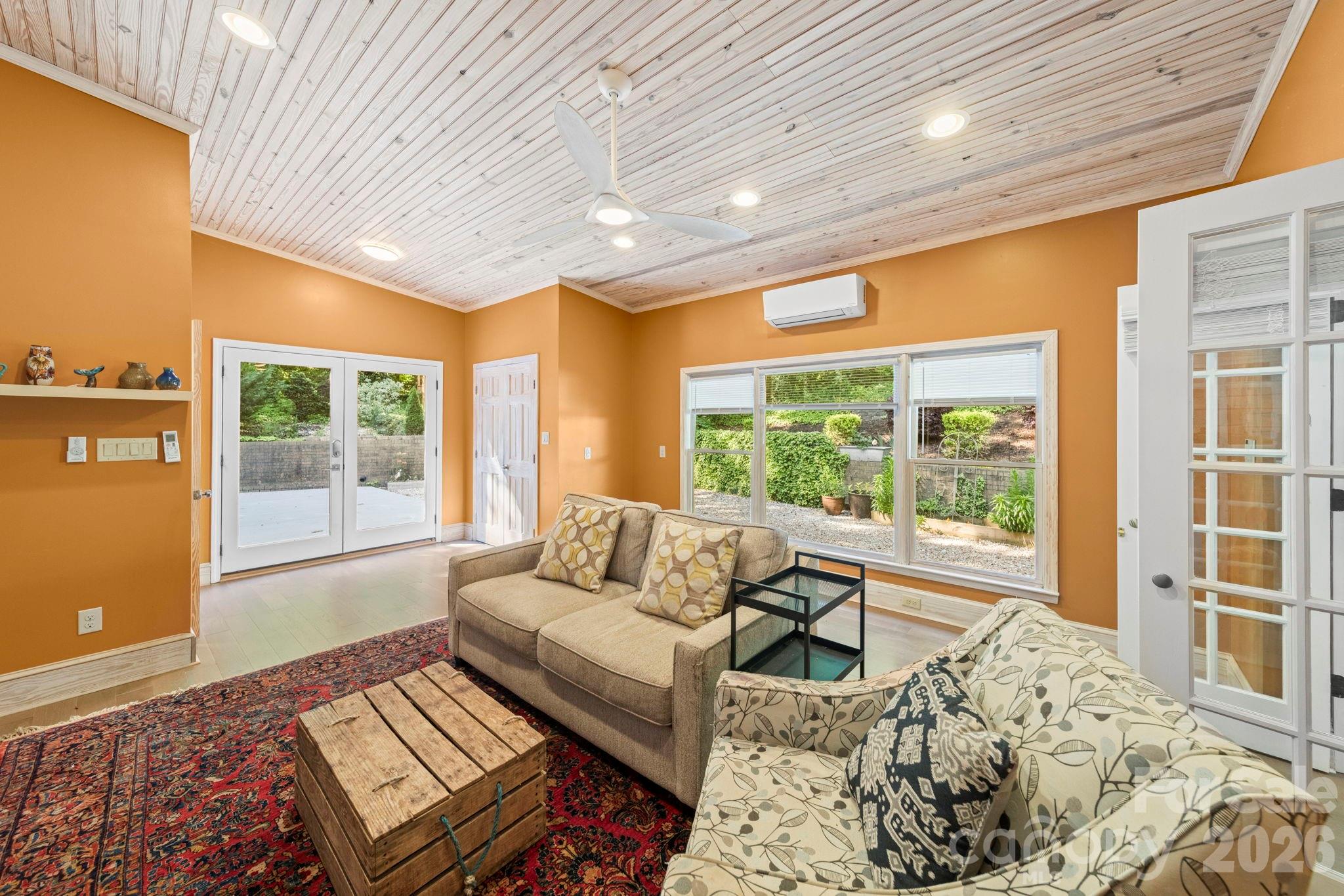 1265 Braeburn Road Northwest Concord, NC 28027 - Photo 21 of 48 a living room with furniture and a large window