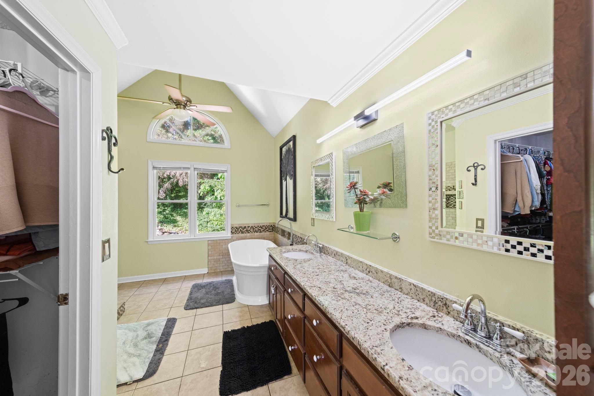 1265 Braeburn Road Northwest Concord, NC 28027 - Photo 25 of 48 a bathroom with a granite countertop double vanity sink and a large mirror