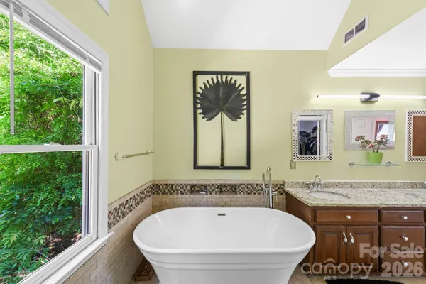 a bathroom with a bathtub and a sink