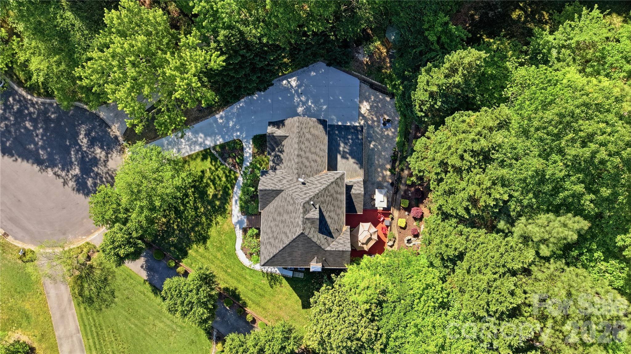 1265 Braeburn Road Northwest Concord, NC 28027 - Photo 42 of 48 an aerial view of a house with a yard and outdoor seating