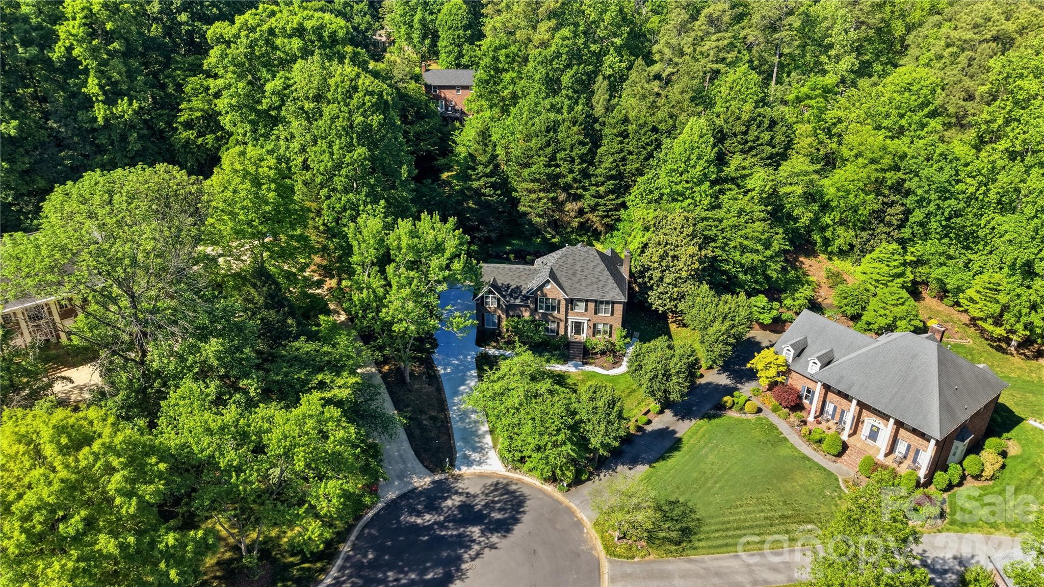 1265 Braeburn Road Northwest Concord, NC 28027 - Photo 45 of 48 a aerial view of a house with a yard and lake view