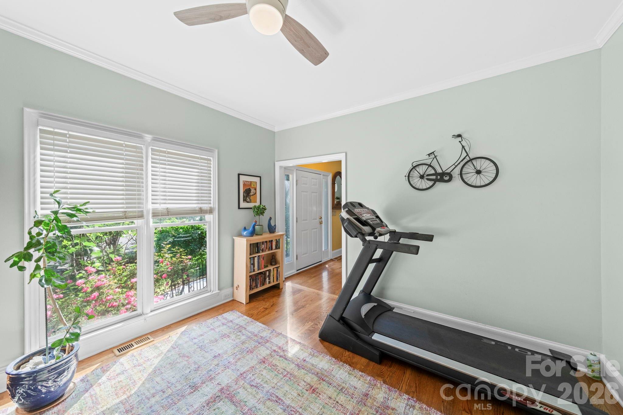 1265 Braeburn Road Northwest Concord, NC 28027 - Photo 5 of 48 a room with gym equipment and large window