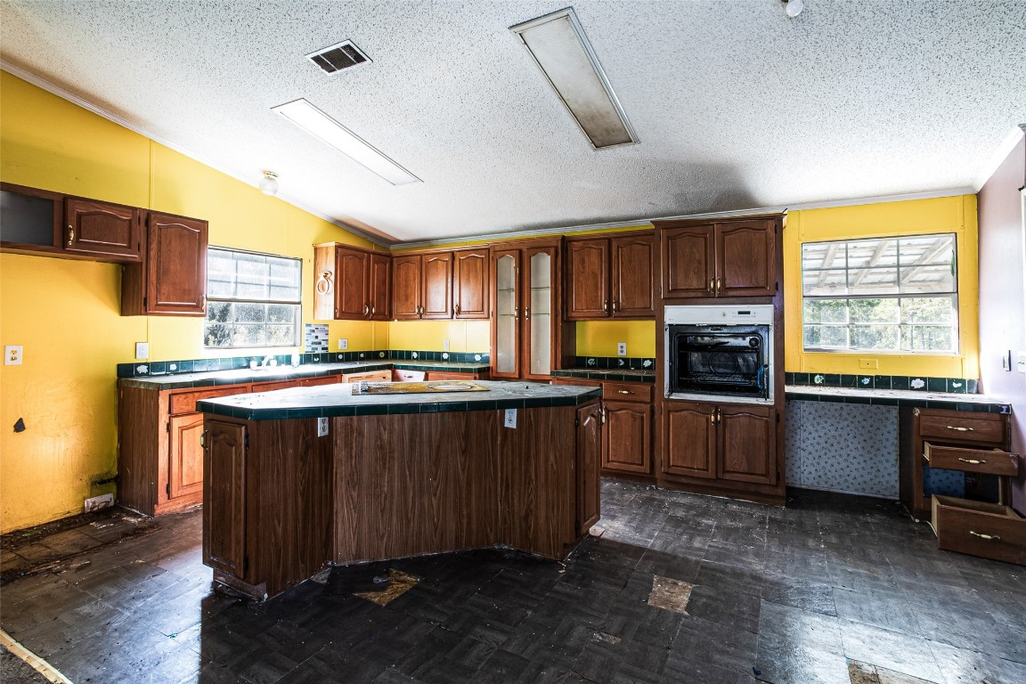 18044 Geranium Lane Hilliard, FL 32046 - Photo 10 of 15 a kitchen with a refrigerator and a stove