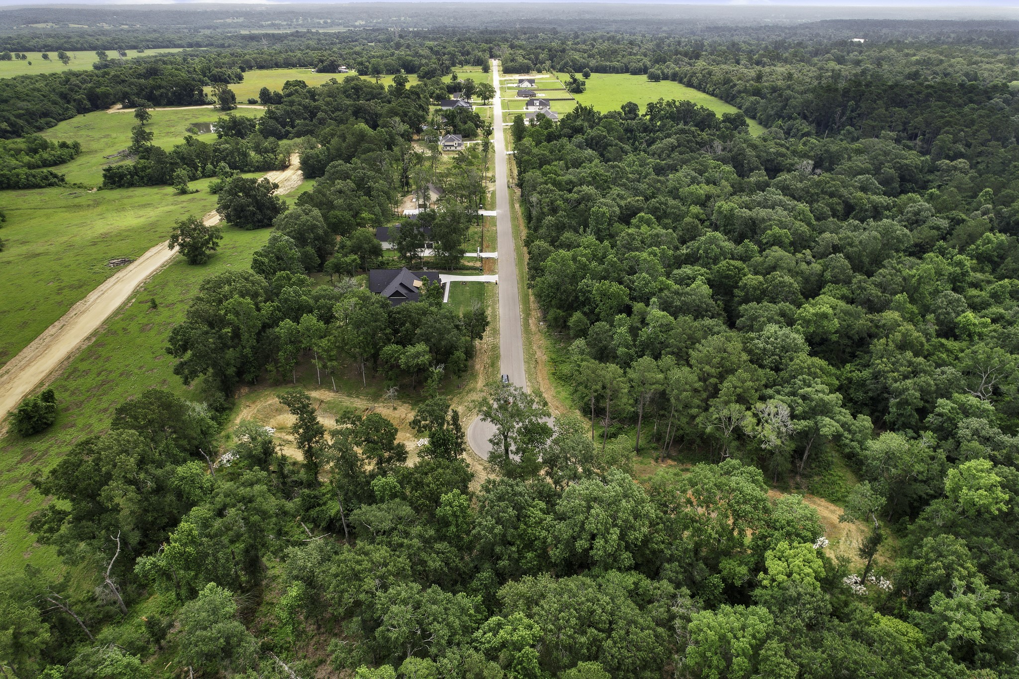 24912 Two Rivers Road Montgomery, TX 77316 - Photo 6 of 7 an aerial view of residential houses with outdoor space and trees