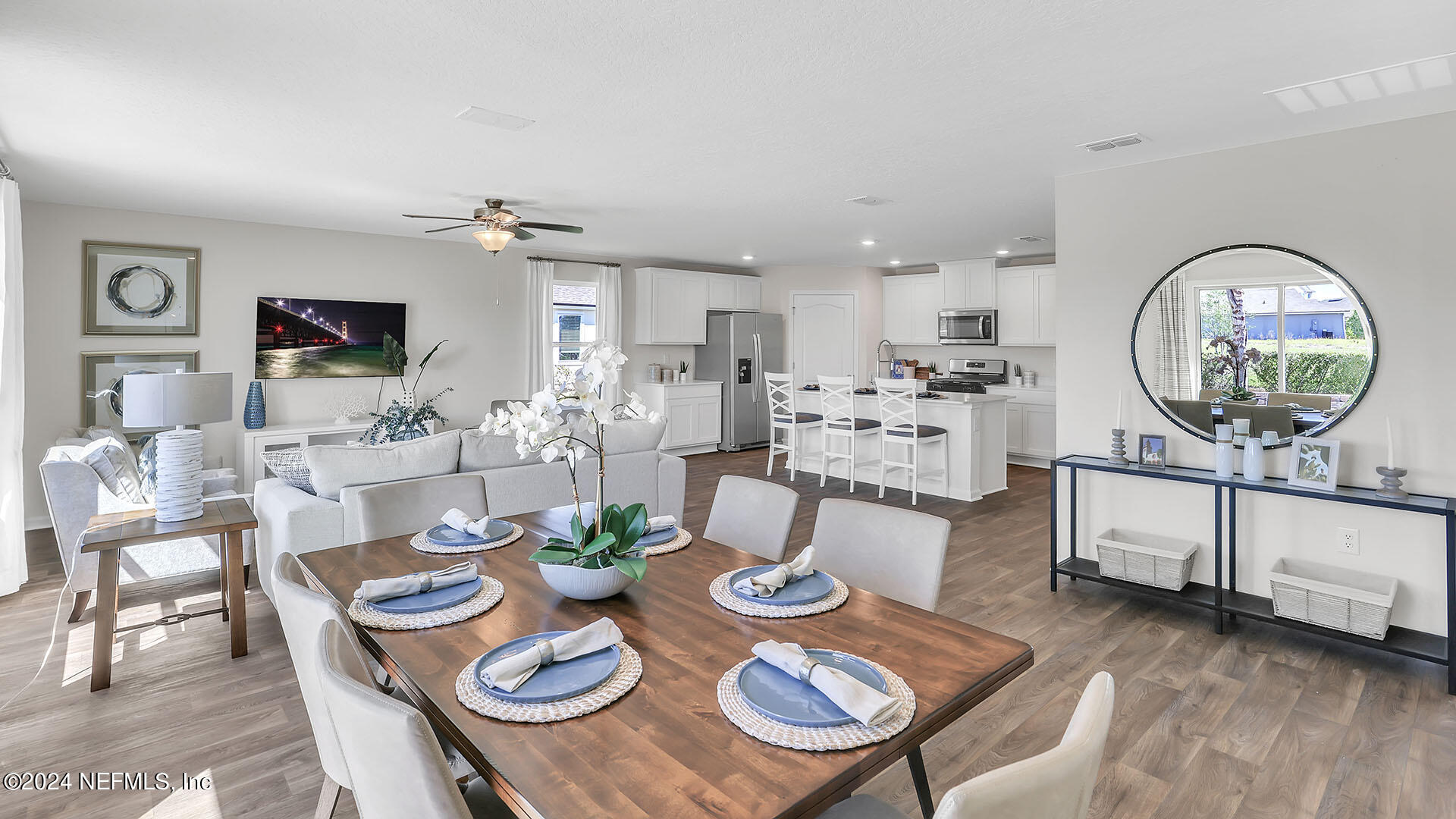 114 Hulett Wds Road Palm Coast, FL 32137 - Photo 15 of 36 a view of a dining room with furniture and wooden floor