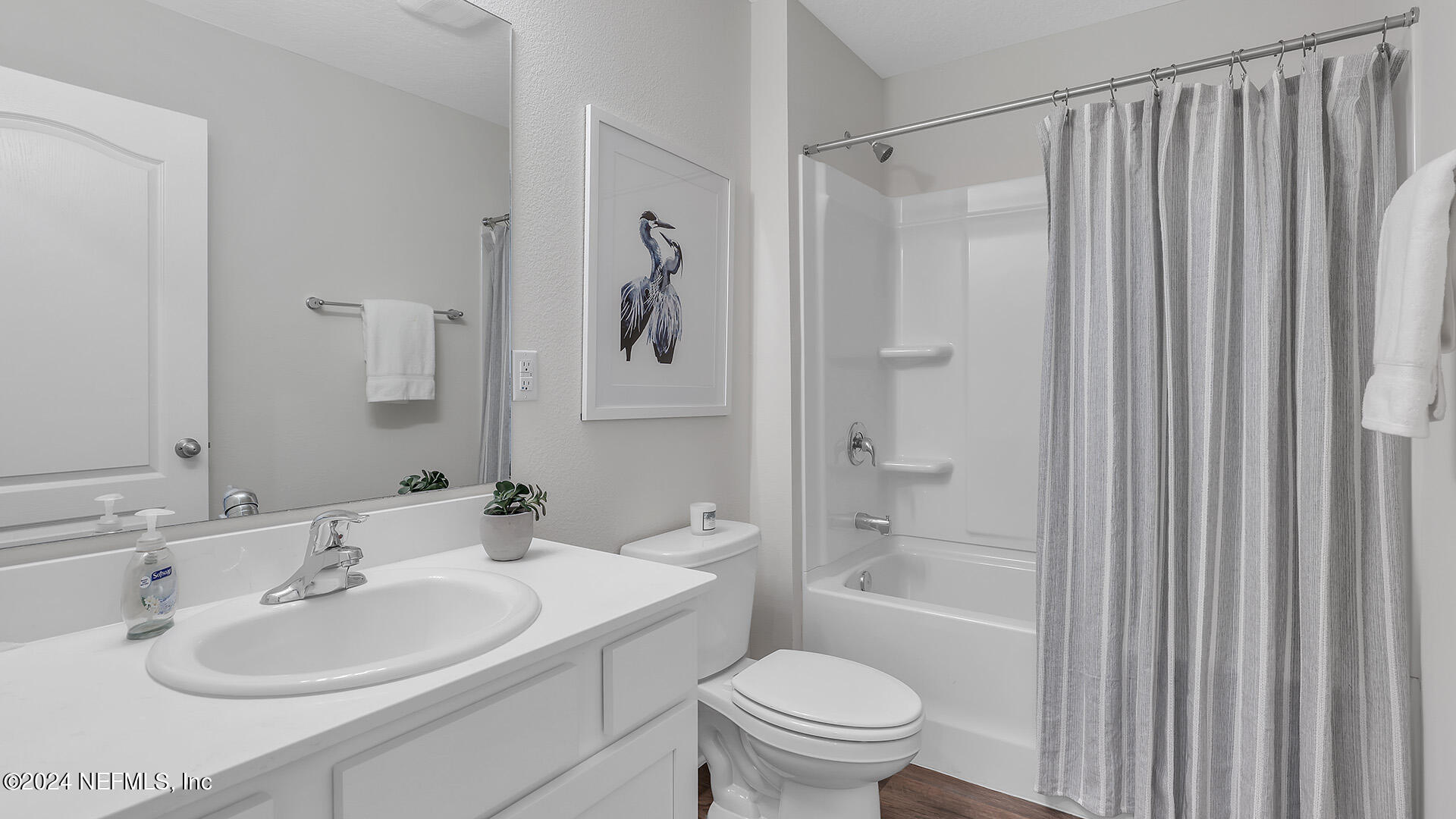 114 Hulett Wds Road Palm Coast, FL 32137 - Photo 24 of 36 a bathroom with a sink toilet and shower