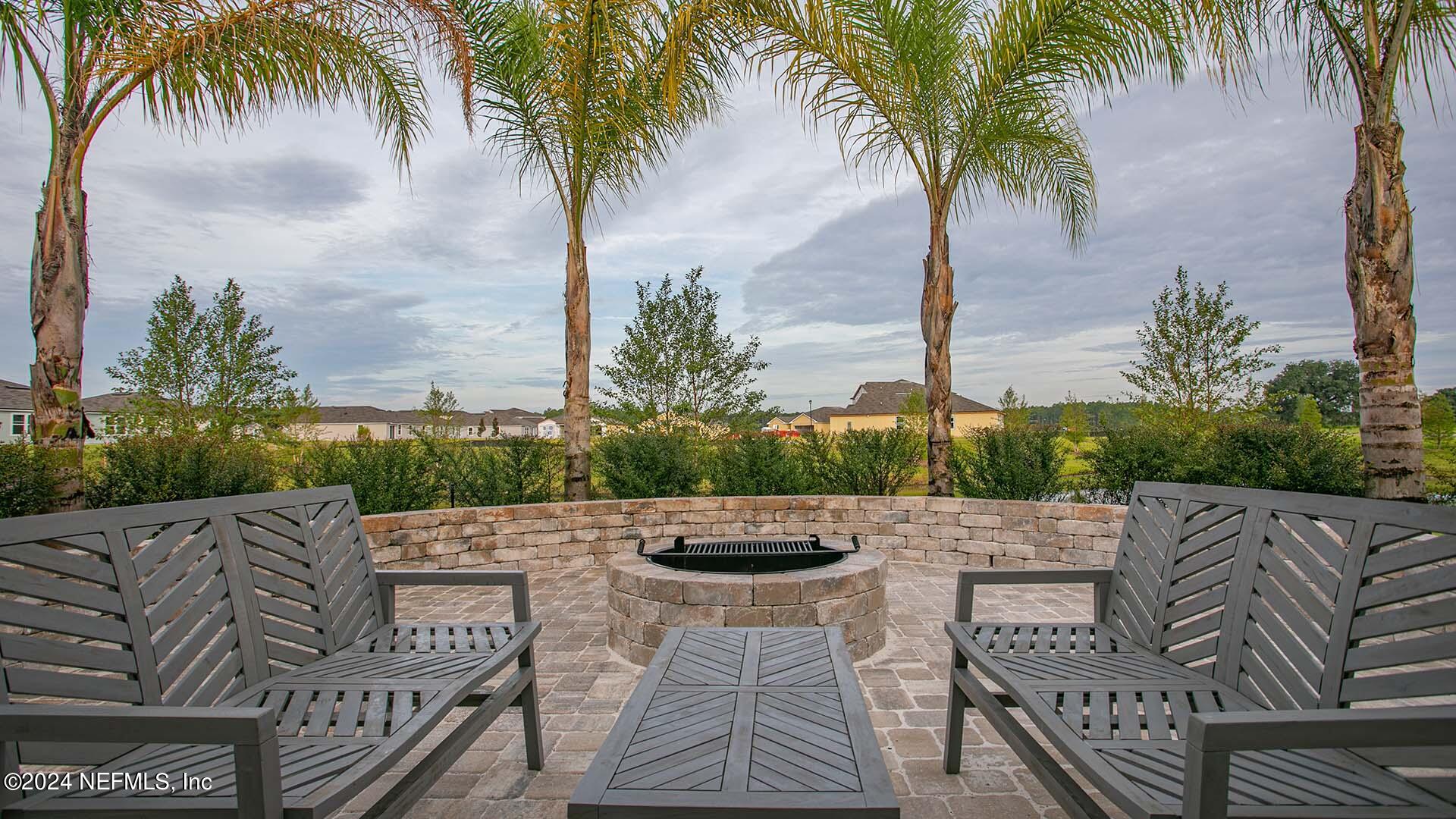 114 Hulett Wds Road Palm Coast, FL 32137 - Photo 26 of 36 a view of outdoor space with swimming pool and lounge chair