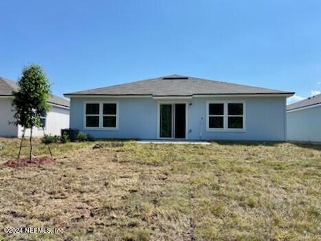 114 Hulett Wds Road Palm Coast, FL 32137 - Photo 4 of 36 a house view with a backyard space