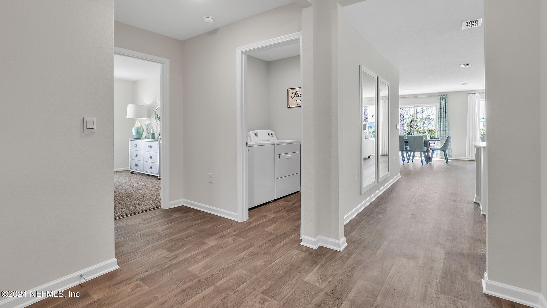 114 Hulett Wds Road Palm Coast, FL 32137 - Photo 6 of 36 a view of a hallway with wooden floor