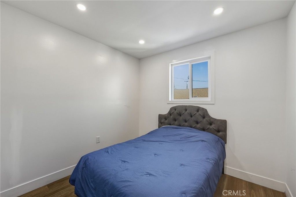 7830 Casa Blanca Street Riverside, CA 92504 - Photo 15 of 27 a view of a big room with wooden floor and windows
