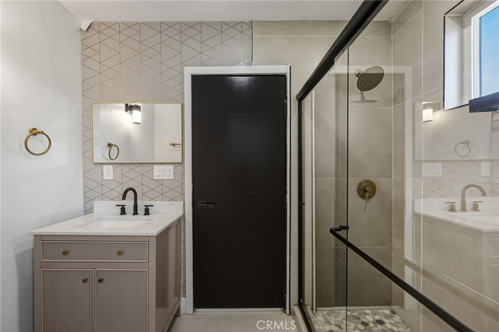 7830 Casa Blanca Street Riverside, CA 92504 - Photo 17 of 27 a bathroom with a sink a toilet and shower