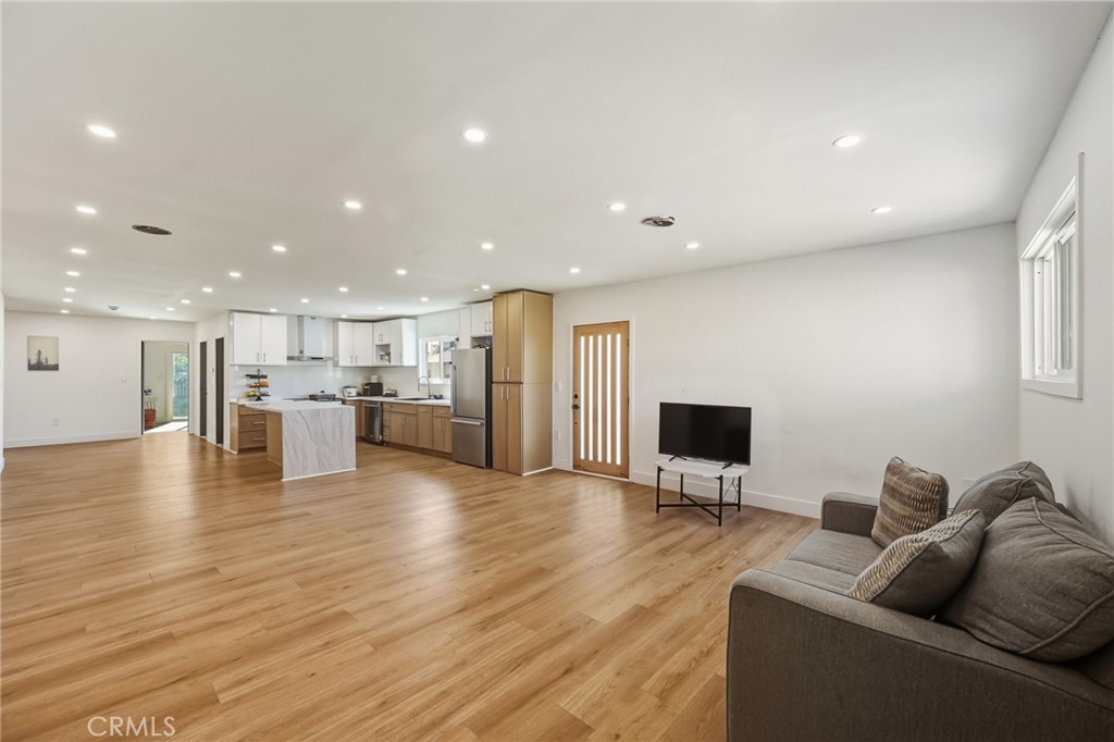 7830 Casa Blanca Street Riverside, CA 92504 - Photo 3 of 27 a living room with furniture and a flat screen tv
