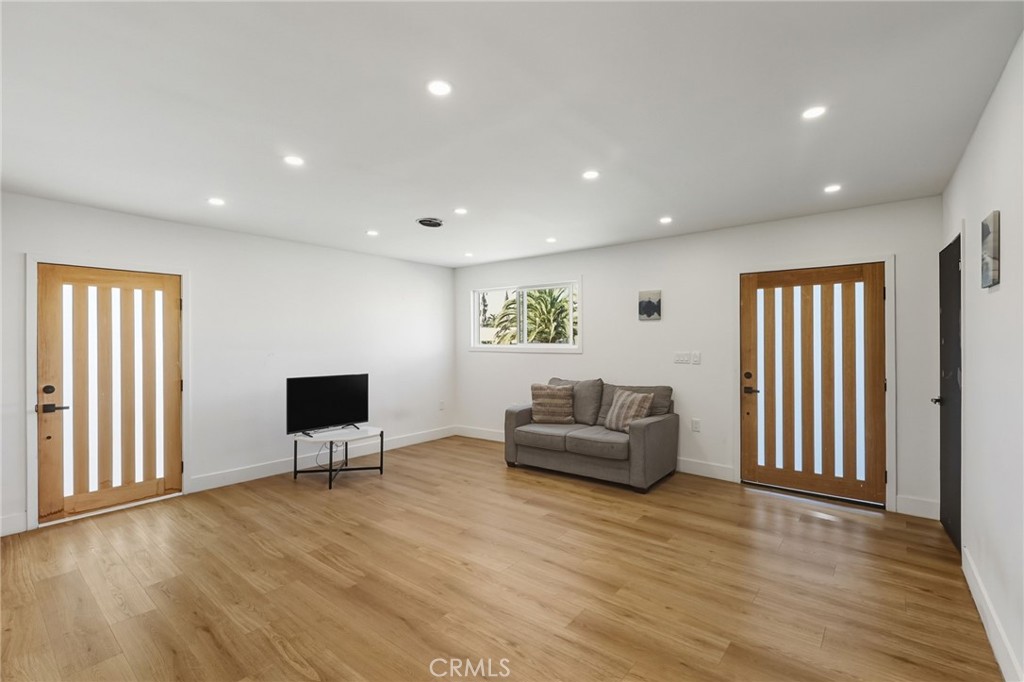 7830 Casa Blanca Street Riverside, CA 92504 - Photo 4 of 27 a living room with furniture and wooden floor