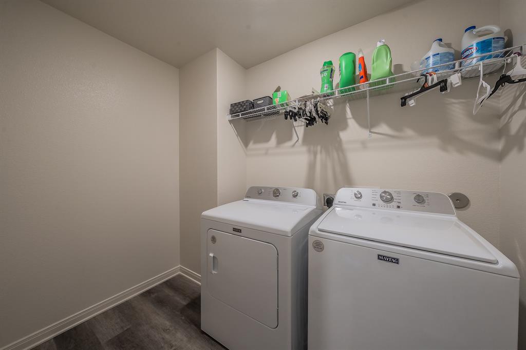 8125 White Sulphur Road Ponder, TX 76259 - Photo 32 of 38 Dedicated laundry space featuring a wire shelving unit and wood-finish flooring