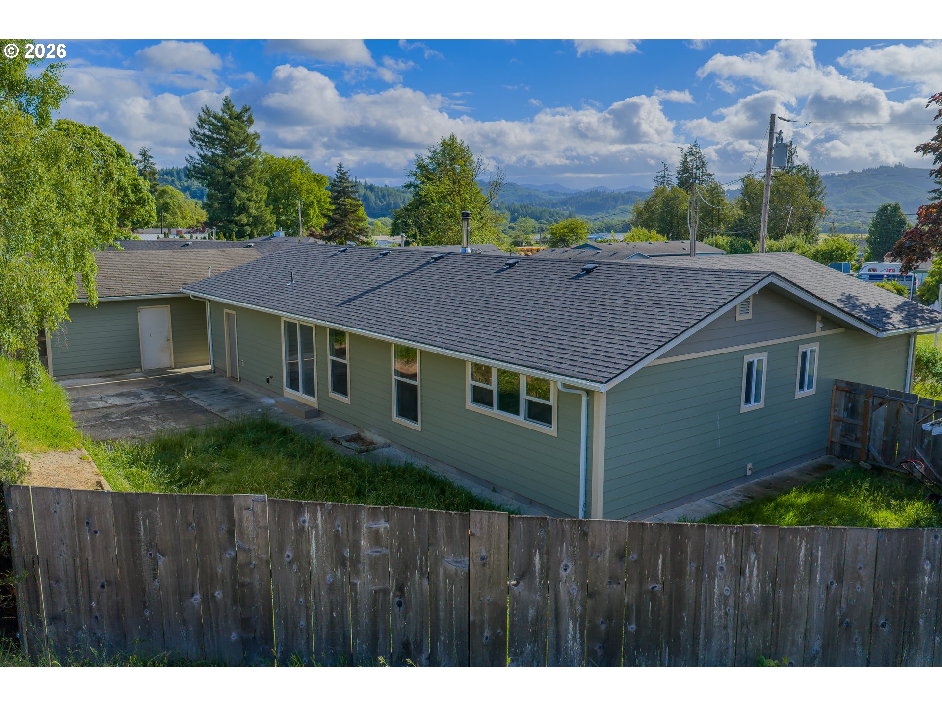 1816 Sunset Court Myrtle Point, OR 97458 - Photo 17 of 42 a aerial view of a house next to a yard