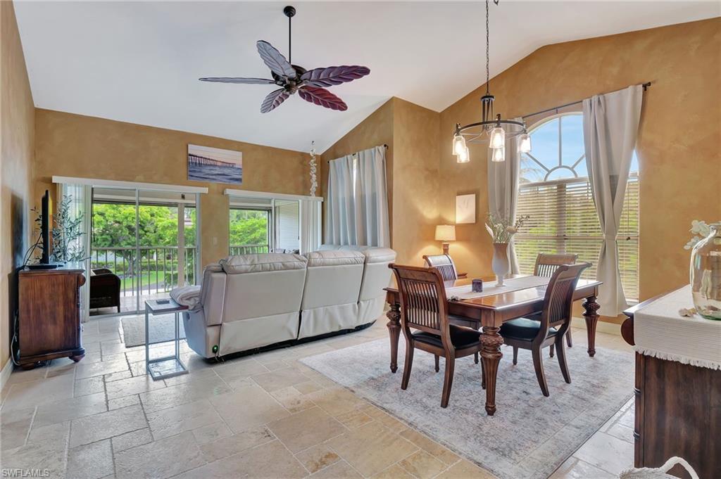 2103 Tama Circle, Unit 202 Naples, FL 34112 - Photo 11 of 28 a dining room with furniture and window