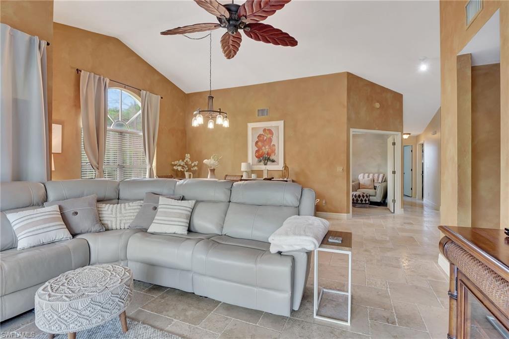 2103 Tama Circle, Unit 202 Naples, FL 34112 - Photo 15 of 28 a living room with furniture and a large window