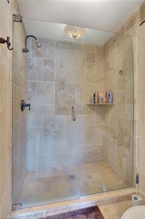 2103 Tama Circle, Unit 202 Naples, FL 34112 - Photo 20 of 28 a bathroom with a shower