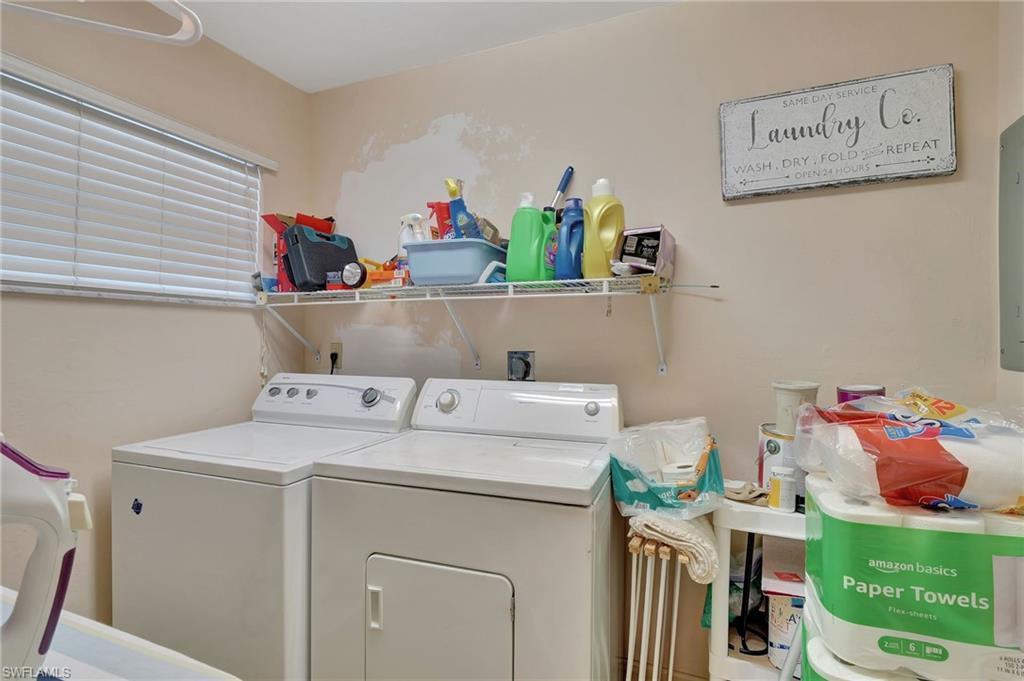 2103 Tama Circle, Unit 202 Naples, FL 34112 - Photo 21 of 28 a utility room with dryer and washer