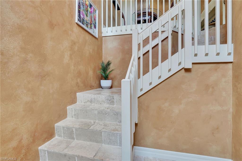 2103 Tama Circle, Unit 202 Naples, FL 34112 - Photo 4 of 28 a view of an entryway with staircase