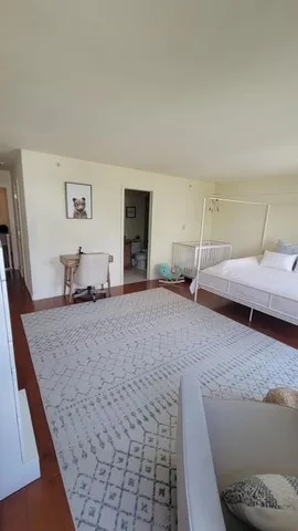 a bedroom with a bed and a couch