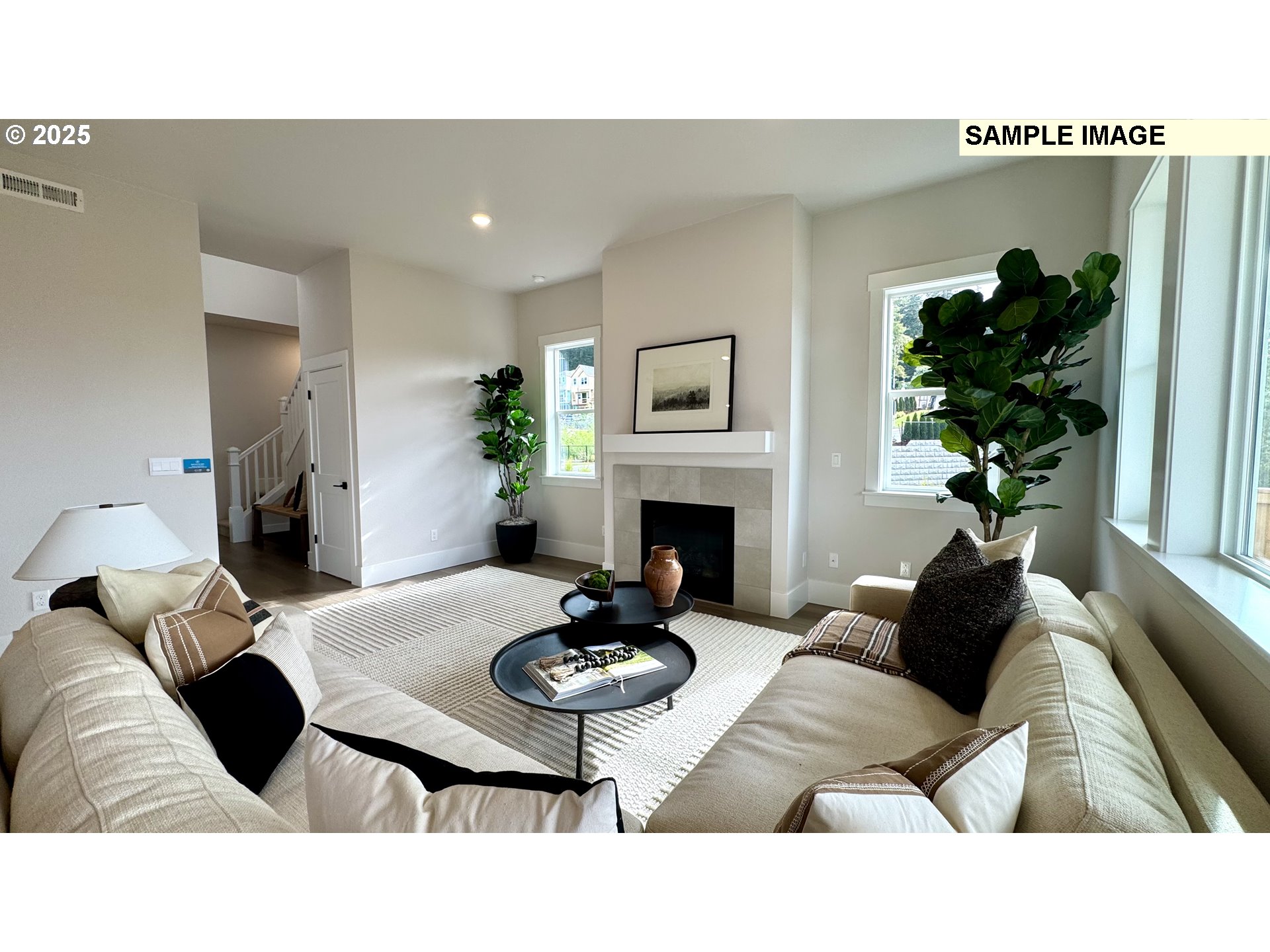 17714 Southwest Watchman Lane Beaverton, OR 97007 - Photo 16 of 22 a living room with furniture potted plant and a fireplace