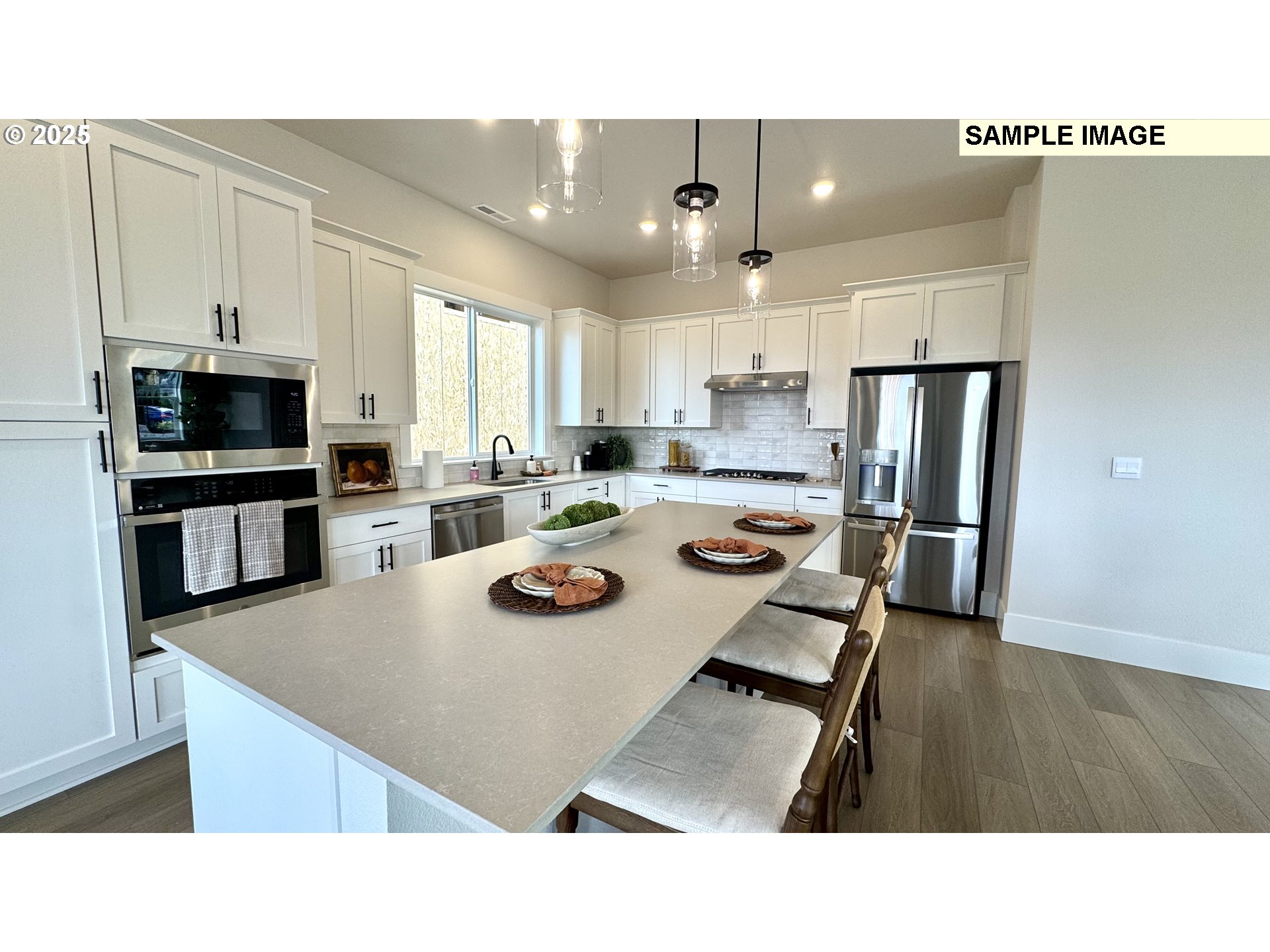 17714 Southwest Watchman Lane Beaverton, OR 97007 - Photo 17 of 22 a kitchen with a refrigerator a stove a sink and a cabinets