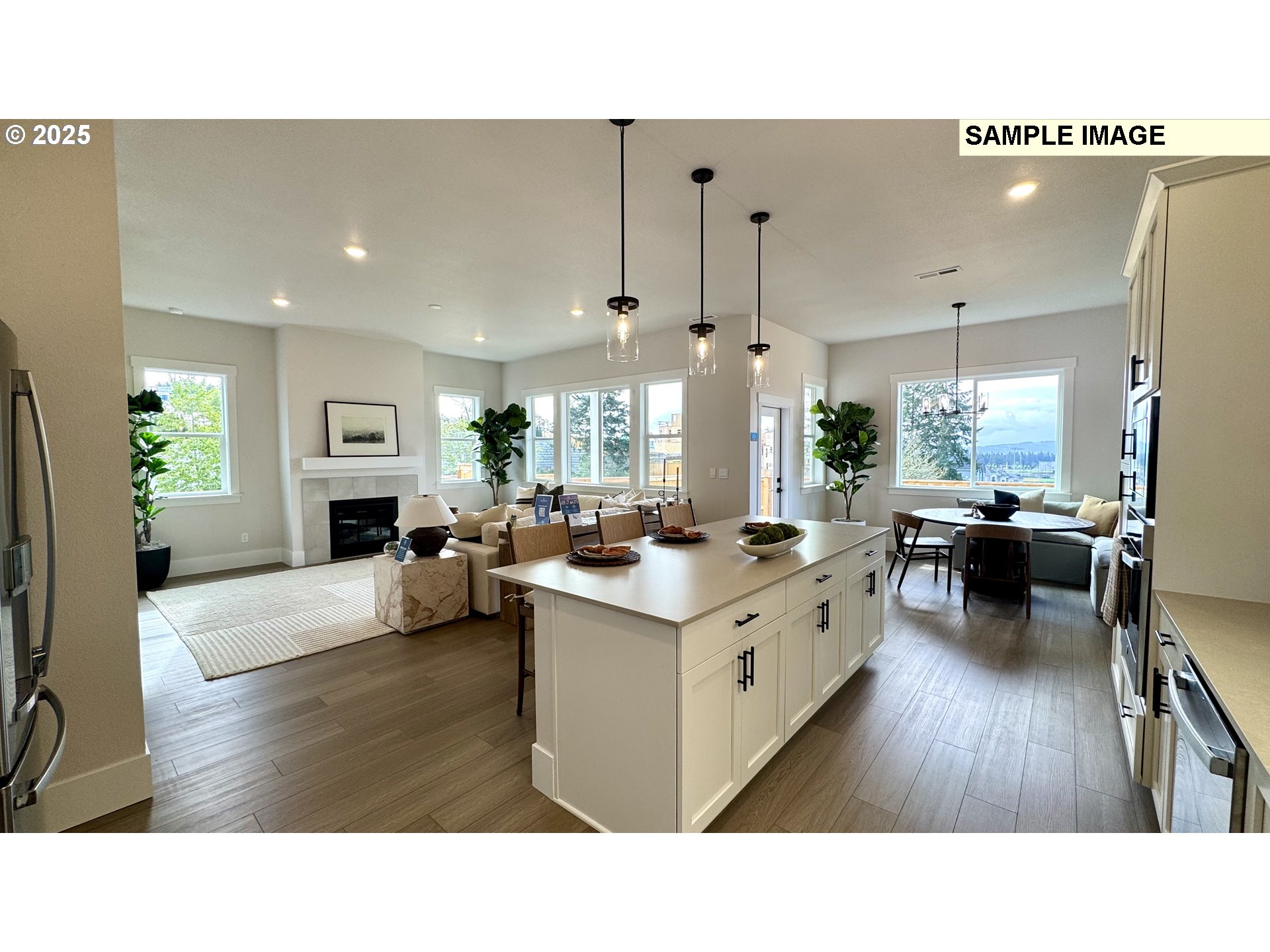 17714 Southwest Watchman Lane Beaverton, OR 97007 - Photo 19 of 22 a open kitchen with sink cabinets and wooden floor