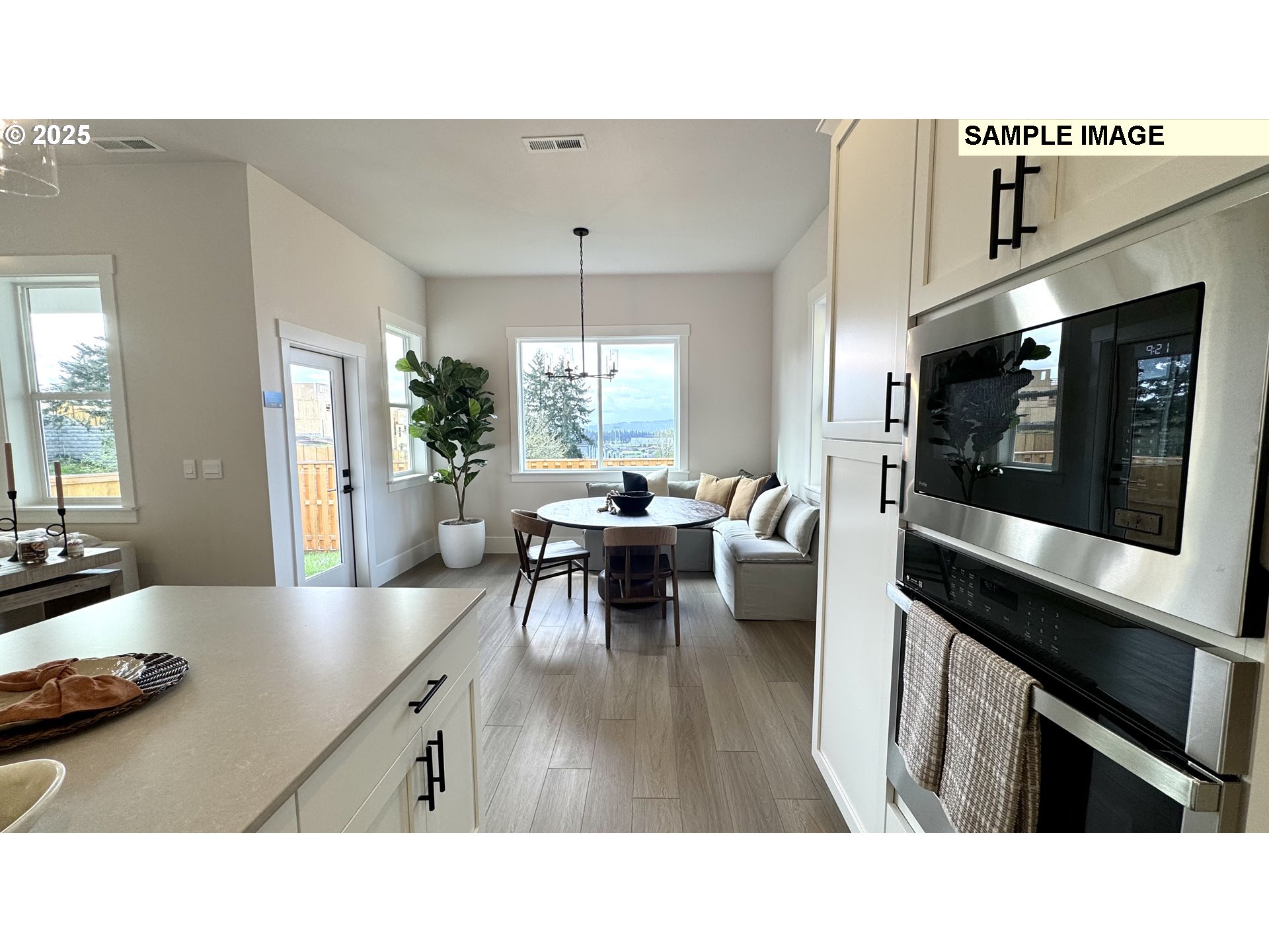 17714 Southwest Watchman Lane Beaverton, OR 97007 - Photo 20 of 22 a living room with furniture and a fireplace