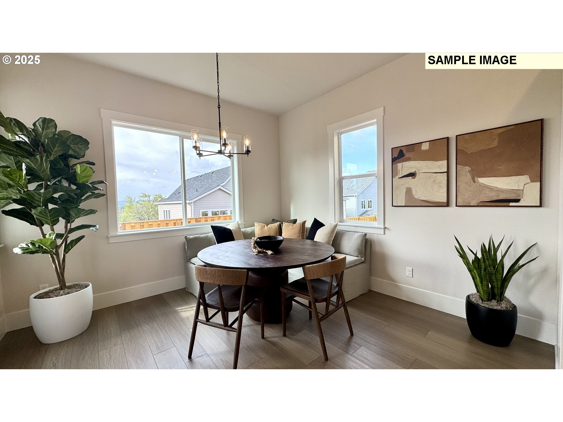 17714 Southwest Watchman Lane Beaverton, OR 97007 - Photo 21 of 22 a living room with furniture potted plant and a window