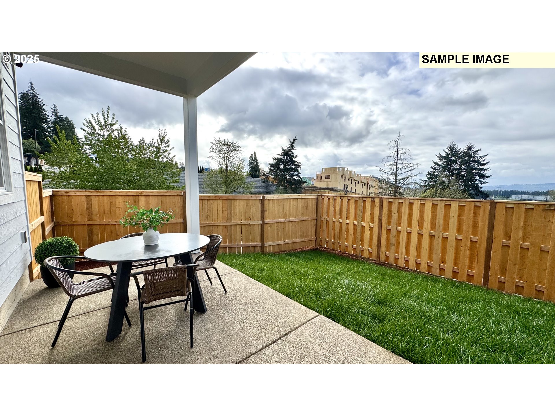 17714 Southwest Watchman Lane Beaverton, OR 97007 - Photo 22 of 22 a backyard of a house with table and chairs