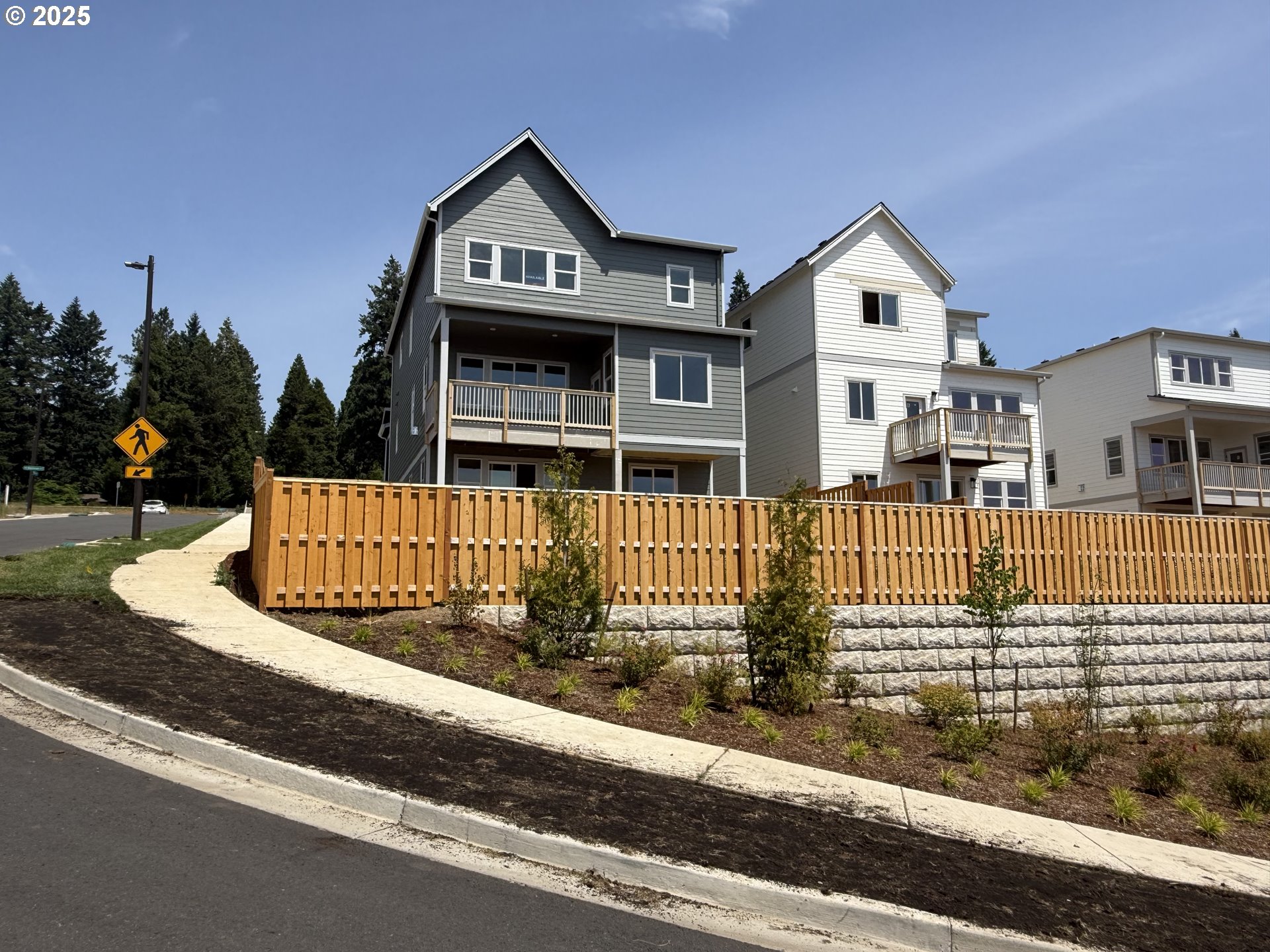 17714 Southwest Watchman Lane Beaverton, OR 97007 - Photo 6 of 22 a front view of a house with garage