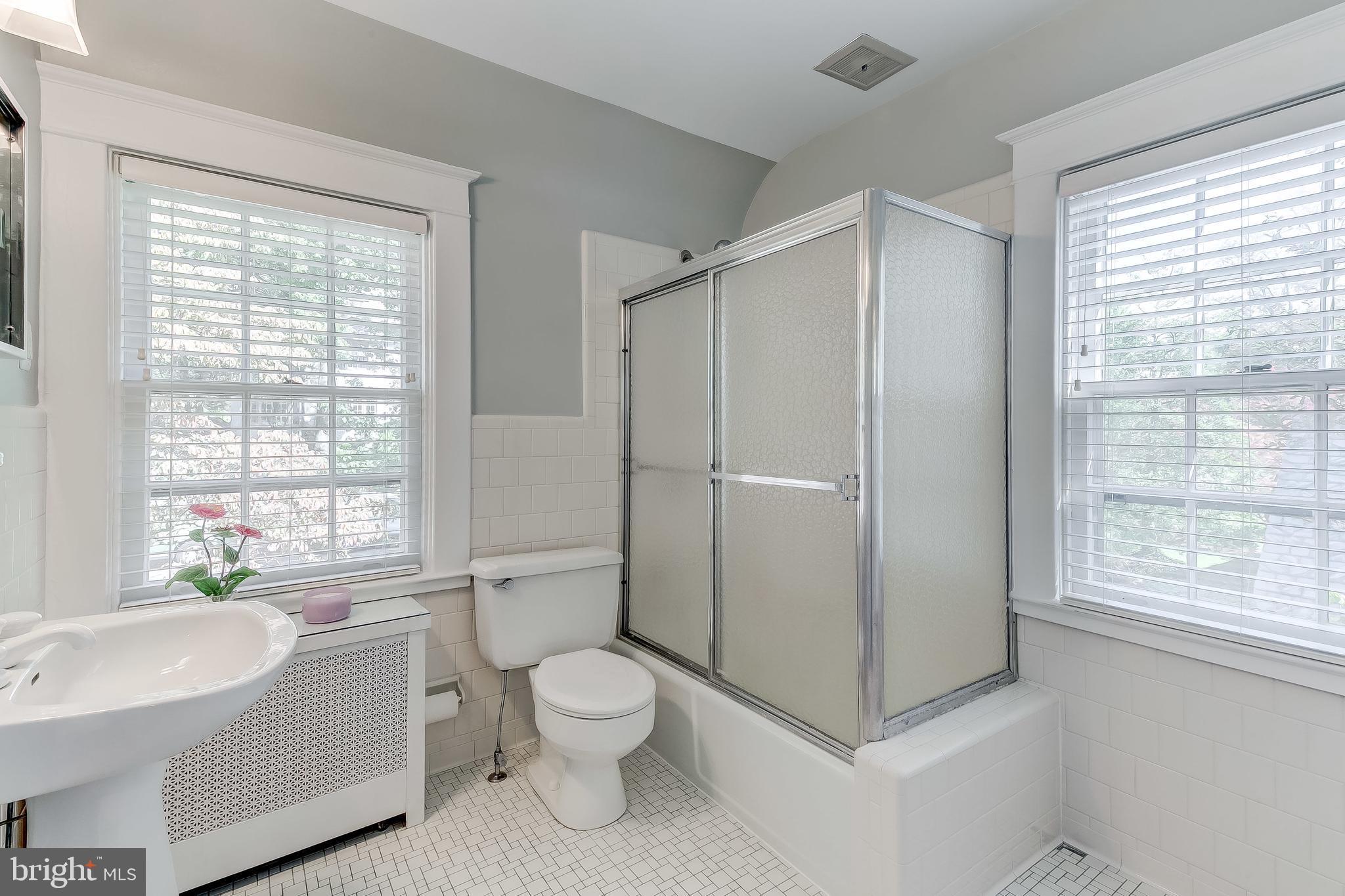 325 Tunbridge Road Baltimore, MD 21212 - Photo 29 of 38 a white toilet sitting next to a bathroom sink
