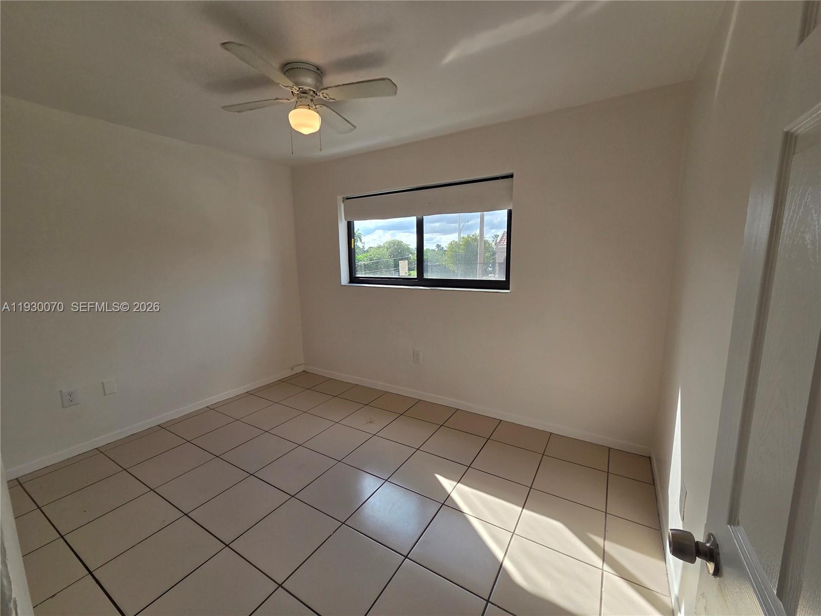 5 Olive Drive, Unit 24 Hialeah, FL 33010 - Photo 11 of 16 an empty room with windows