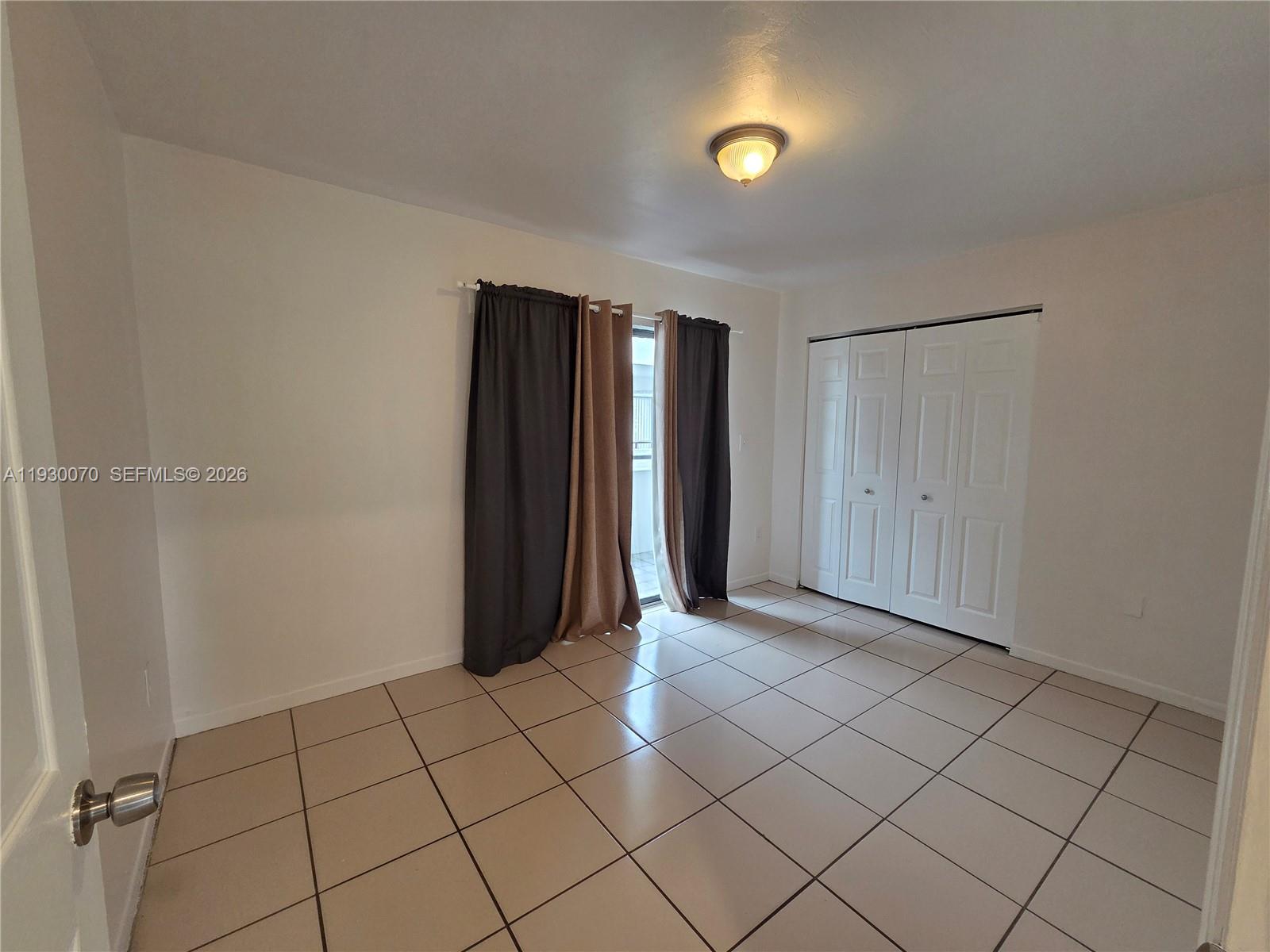 5 Olive Drive, Unit 24 Hialeah, FL 33010 - Photo 7 of 16 a view of an empty room and window