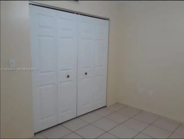 a white toilet sitting next to a bath tub