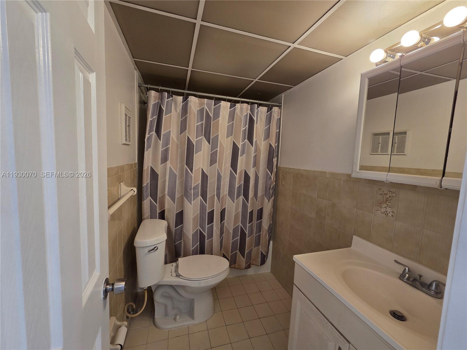 5 Olive Drive, Unit 24 Hialeah, FL 33010 - Photo 10 of 16 a bathroom with a sink toilet and shower
