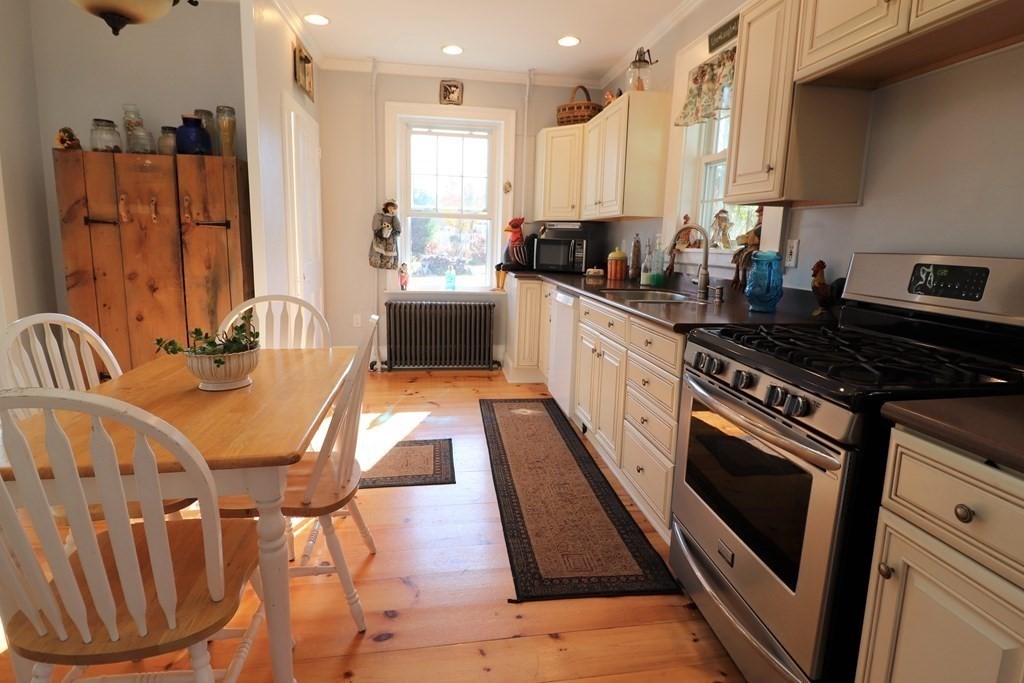 751 Snipatuit Road Rochester, MA 02770 - Photo 13 of 42 a kitchen with stainless steel appliances granite countertop a stove a sink and a refrigerator