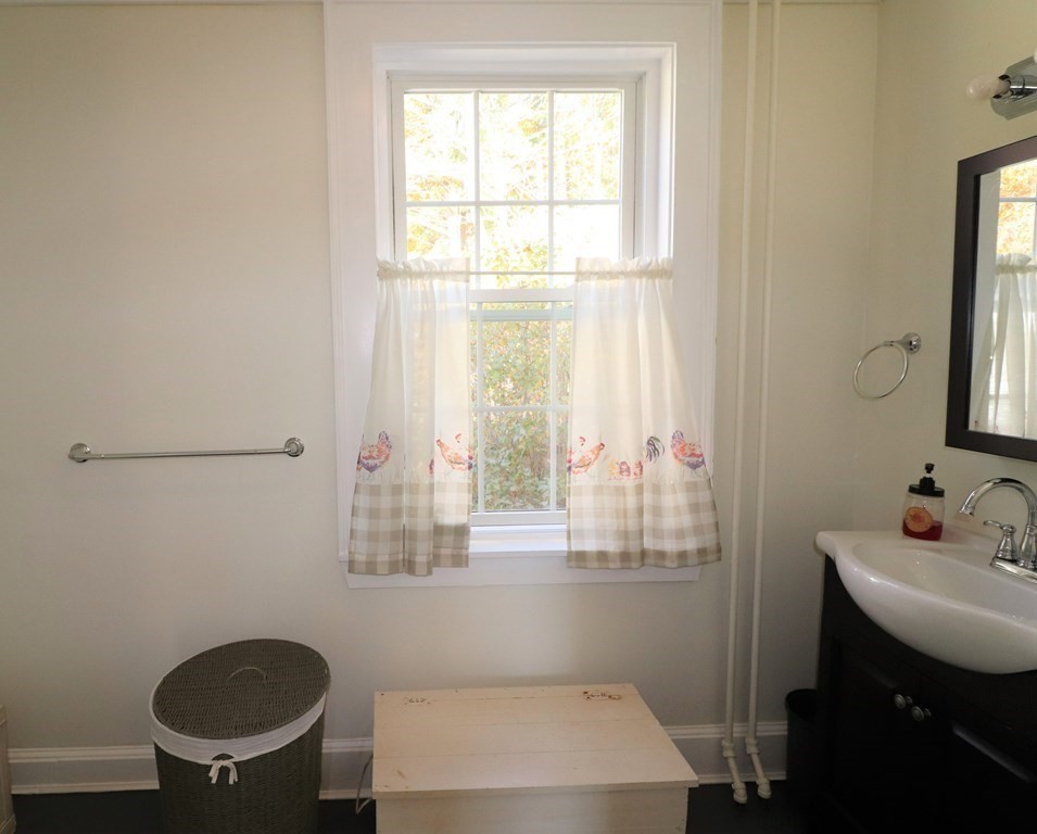 751 Snipatuit Road Rochester, MA 02770 - Photo 17 of 42 a bathroom with a sink and a toilet
