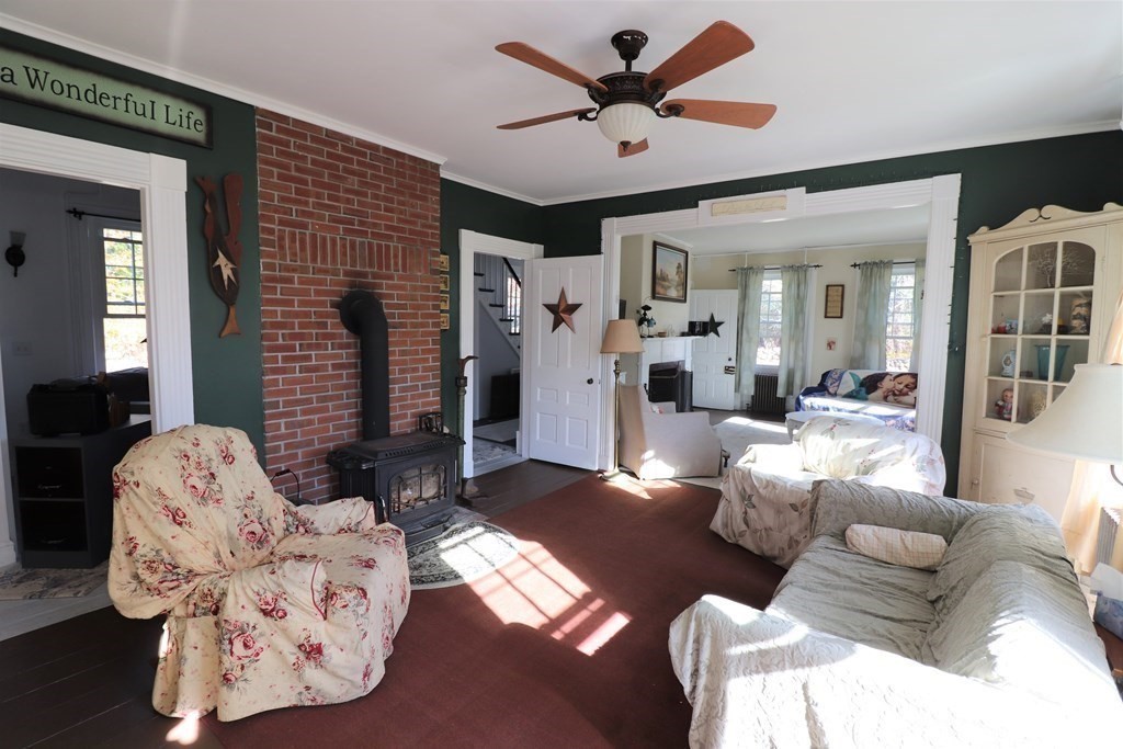 751 Snipatuit Road Rochester, MA 02770 - Photo 19 of 42 a living room with furniture and a large window