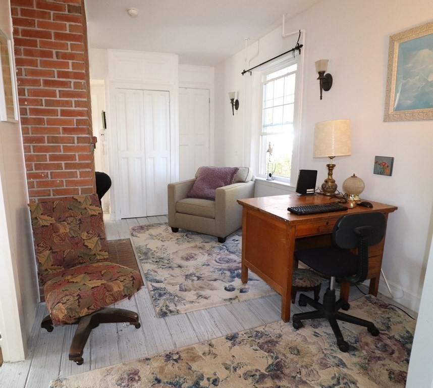 751 Snipatuit Road Rochester, MA 02770 - Photo 25 of 42 a living room with furniture and a window