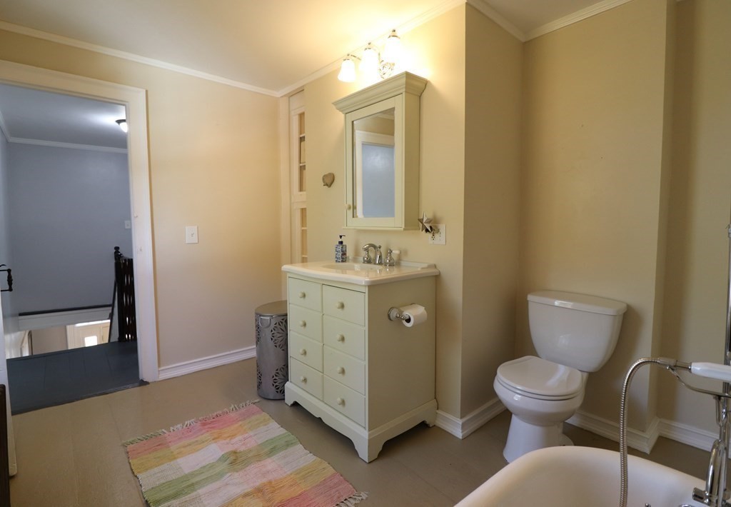 751 Snipatuit Road Rochester, MA 02770 - Photo 31 of 42 a bathroom with a toilet sink and mirror