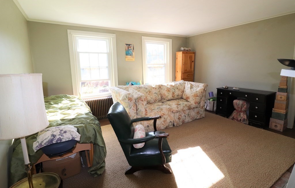 751 Snipatuit Road Rochester, MA 02770 - Photo 34 of 42 a bedroom with furniture and a window