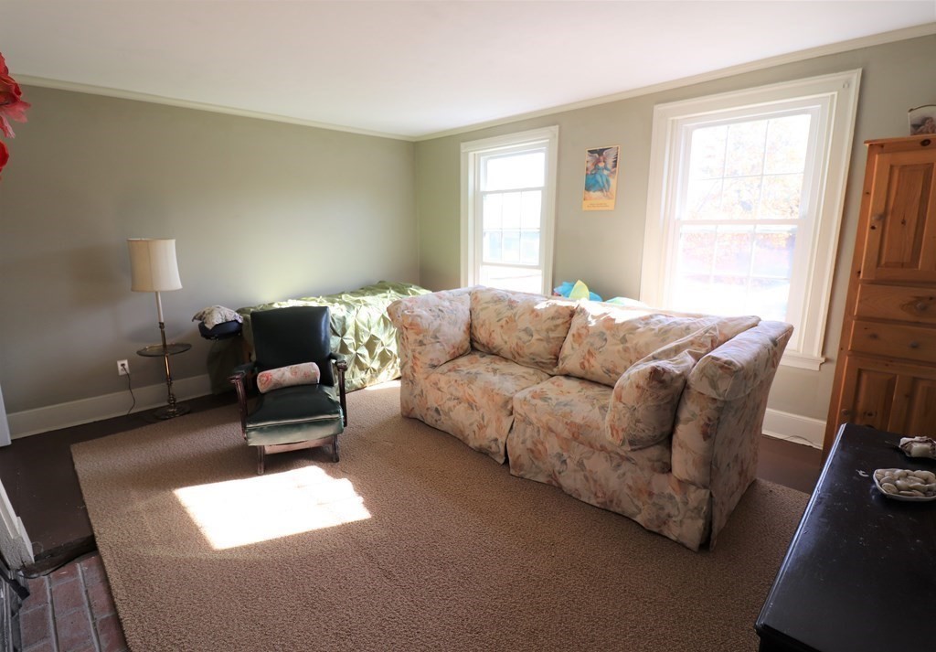 751 Snipatuit Road Rochester, MA 02770 - Photo 35 of 42 a living room with furniture and a window
