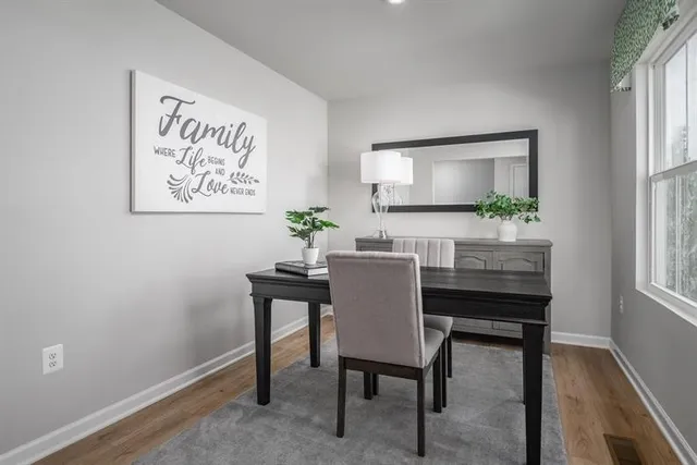 a dining room with a table and chairs