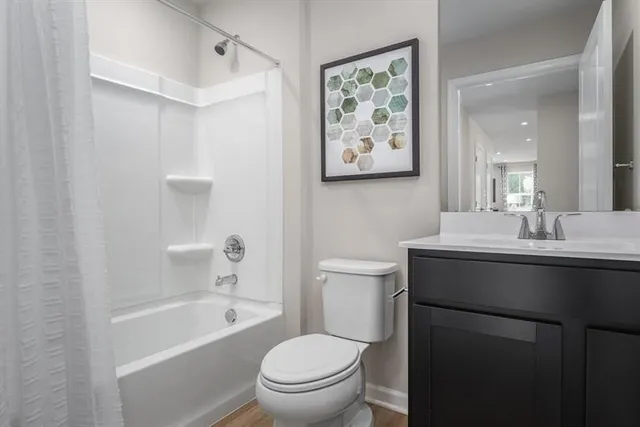 a bathroom with a sink toilet and bathtub