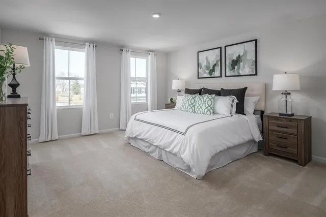 a bed room with a bed and a night stand