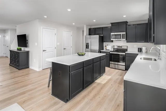 a kitchen with wooden cabinets a sink and appliances